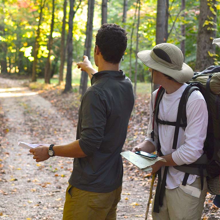 Two hikers in the woods